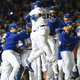 Chicago Cubs third baseman Javier Baez jumps with his team after winning the National League Championship. (Photo by Patrick Gorski/Icon Sportswire/Getty Images)